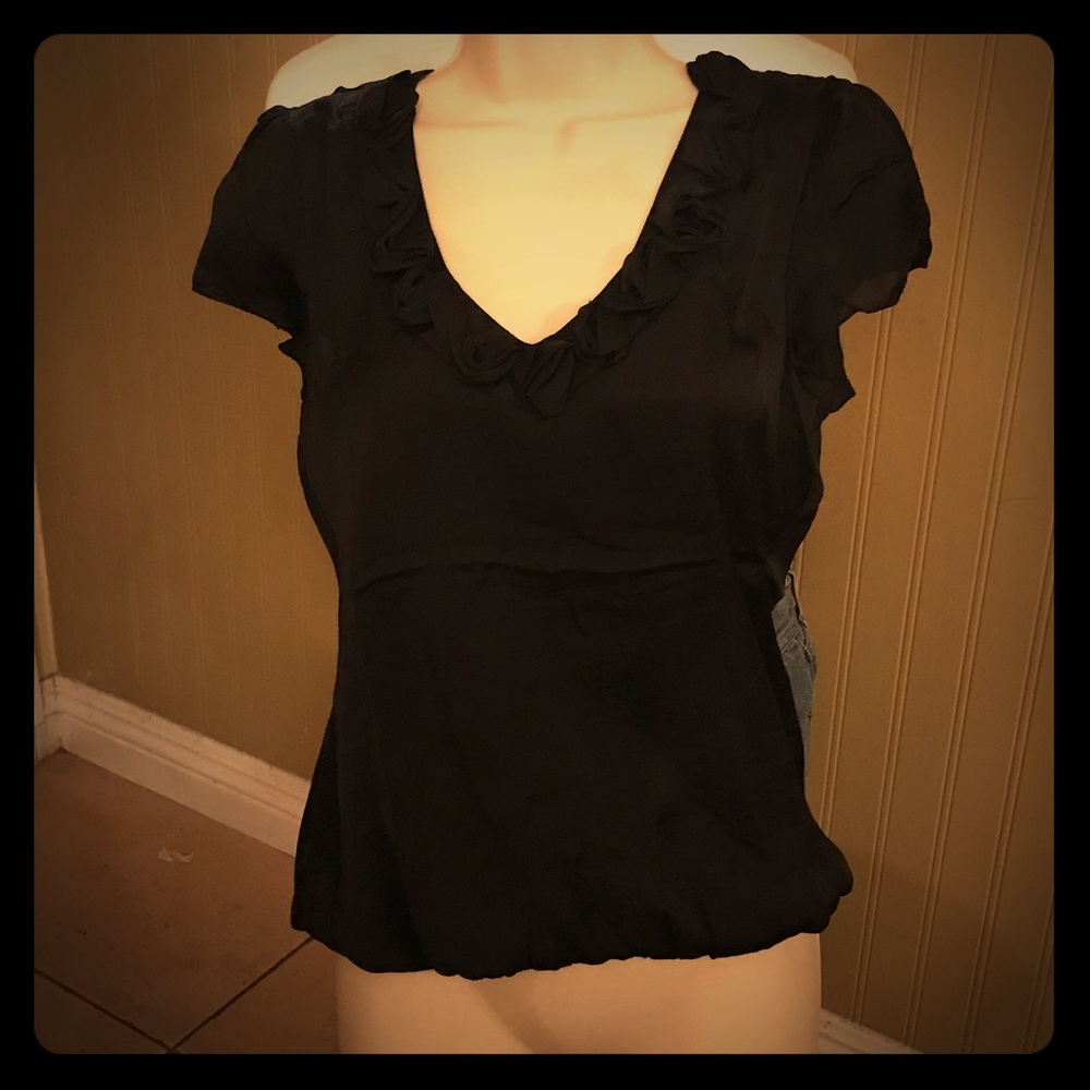 Black ruffled V Neck top.